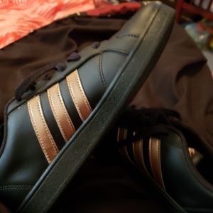 Black and Gold Adidas shoes